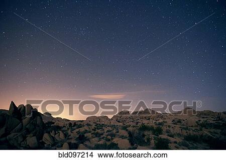 Picture - Stars in sky over desert. Fotosearch