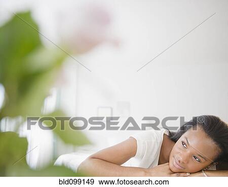 Stock Photo - Tranquil Black woman thinking. Fotosearch