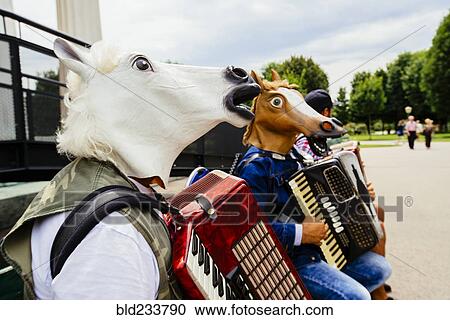 Accordionists wearing horse masks View Large Photo Image Stock Image - Accordionists wearing horse masks . Fotosearch