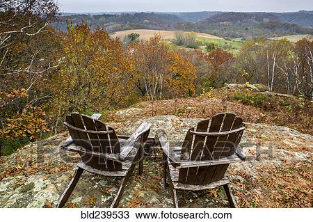Adirondack chairs in rolling landscape View Large Photo Image Stock Image - Adirondack chairs in rolling landscape. Fotosearch