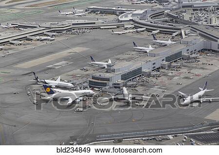 Stock Photo - Aerial view of airplanes at airport terminal. Fotosearch