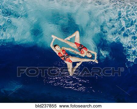 Aerial view of Caucasian synchronized swimmers View Large Photo Image Stock Photography - Aerial view of Caucasian synchronized swimmers. Fotosearch