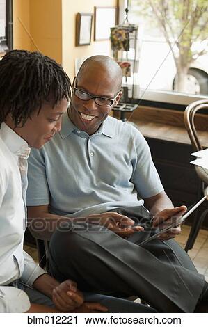 African American co-workers talking in restaurant View Large Photo Image Stock Image - African American co-workers talking in restaurant. Fotosearch