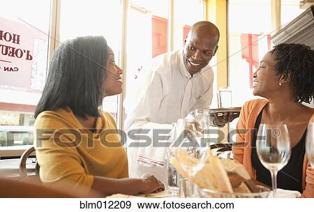 African American friends having lunch in restaurant View Large Photo Image Stock Photo - African American friends having lunch in restaurant. Fotosearch