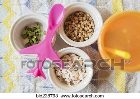 Airplane spoon on bowls of baby food View Large Photo Image Stock Image - Airplane spoon on bowls of baby food. Fotosearch