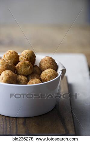 Stock Photo - Arancini balls in bowl. Fotosearch