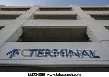 Arrow and terminal sign on parking garage View Large Photo Image Stock Photography - Arrow and terminal sign on parking garage. Fotosearch