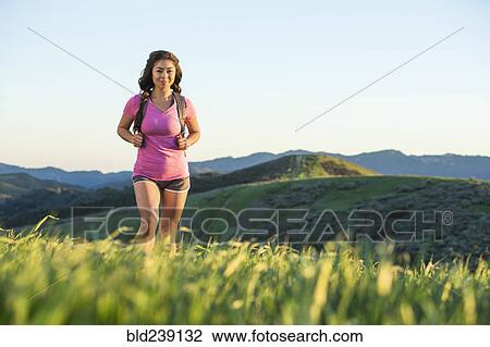 Asian woman hiking on hill View Large Photo Image Stock Image - Asian woman hiking on hill. Fotosearch