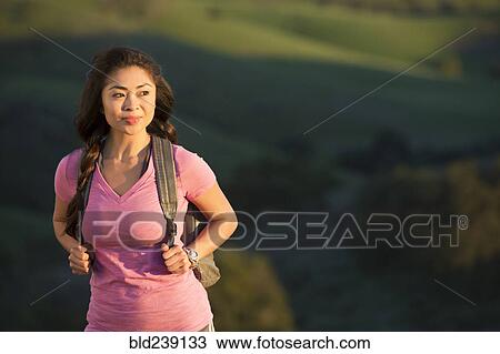 Asian woman hiking on hill View Large Photo Image Stock Image - Asian woman hiking on hill. Fotosearch