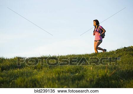 Asian woman hiking on hill View Large Photo Image Stock Photography - Asian woman hiking on hill. Fotosearch