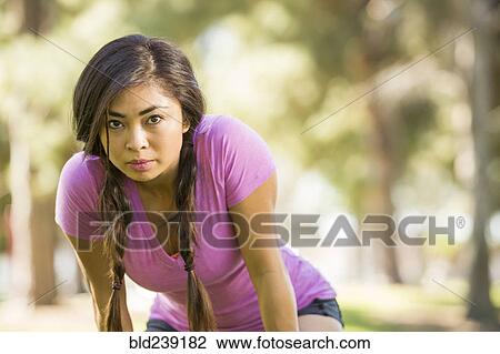 Asian woman resting outdoors View Large Photo Image Stock Image - Asian woman resting outdoors. Fotosearch