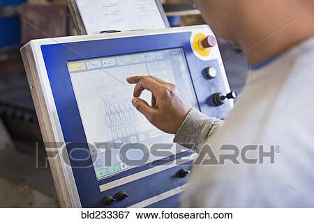 Asian worker using control panel in factory View Large Photo Image Stock Photo - Asian worker using control panel in factory. Fotosearch