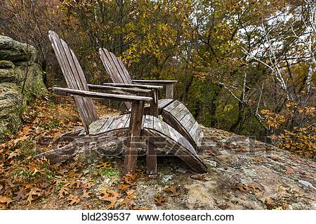 Autumn leaves near adirondack chairs View Large Photo Image Stock Photo - Autumn leaves near adirondack chairs. Fotosearch