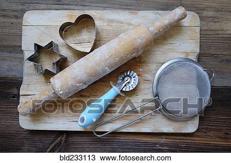 Stock Image - Baking tools on cutting board. Fotosearch