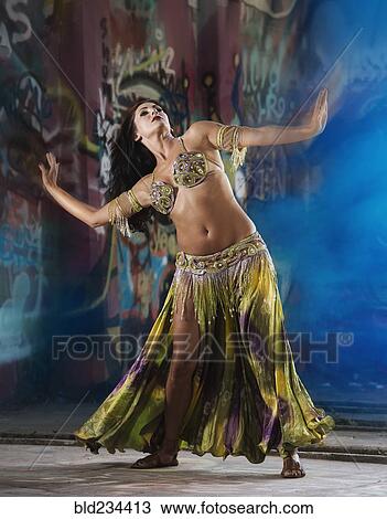 Stock Image - Belly dancer on stage. Fotosearch