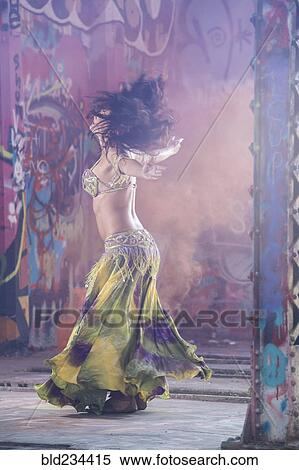 Belly dancer spinning on stage View Large Photo Image Stock Photography - Belly dancer spinning on stage. Fotosearch