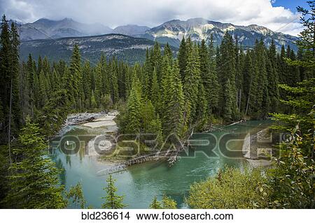 Bending river near mountain range View Large Photo Image Picture - Bending river near mountain range. Fotosearch