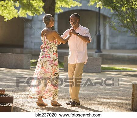 Black couple dancing in park View Large Photo Image Stock Image - Black couple dancing in park. Fotosearch