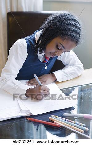 Black girl wearing school uniform doing homework View Large Photo Image Stock Image - Black girl wearing school uniform doing homework. Fotosearch