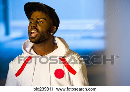 Black man yelling outdoors View Large Photo Image Stock Image - Black man yelling outdoors. Fotosearch