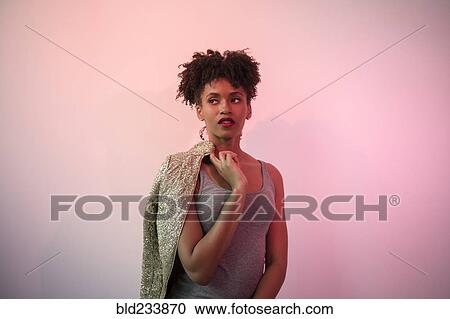 Black woman carrying glamorous jacket on shoulder View Large Photo Image Stock Image - Black woman carrying glamorous jacket on shoulder. Fotosearch