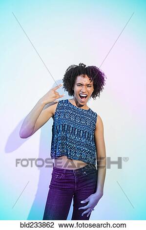 Black woman gesturing with fingers View Large Photo Image Stock Image - Black woman gesturing with fingers. Fotosearch