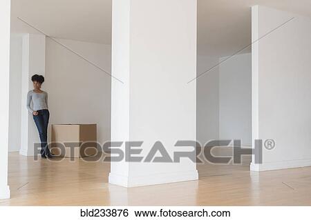 Black woman leaning on pillar in empty apartment View Large Photo Image Stock Photograph - Black woman leaning on pillar in empty apartment. Fotosearch