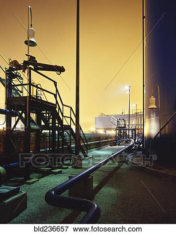 Blue industrial pipes and storage tank View Large Photo Image Stock Photo - Blue industrial pipes and storage tank. Fotosearch