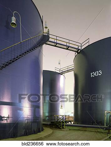 Stock Photograph - Blue storage tanks. Fotosearch