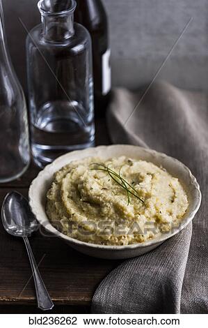 Stock Image - Bowl of cheese grits. Fotosearch