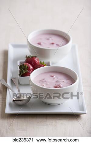 Bowls of fruit soup with strawberries and spoons View Large Photo Image Stock Image - Bowls of fruit soup with strawberries and spoons. Fotosearch