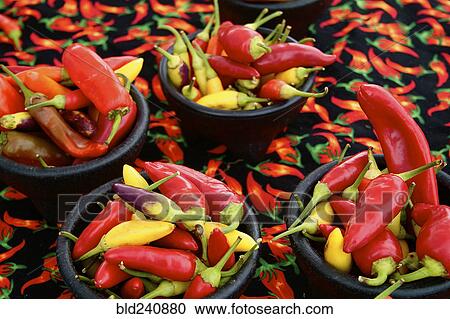 Stock Image - Bowls of yellow and red peppers. Fotosearch