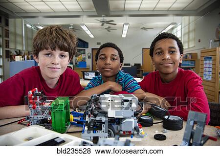 Boys posing with plastic blocks in library View Large Photo Image Stock Photo - Boys posing with plastic blocks in library. Fotosearch