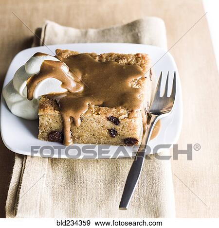 Bread pudding dessert on plate with fork View Large Photo Image Stock Photo - Bread pudding dessert on plate with fork. Fotosearch