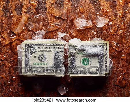 Broken dollar frozen in ice View Large Photo Image Stock Image - Broken dollar frozen in ice. Fotosearch