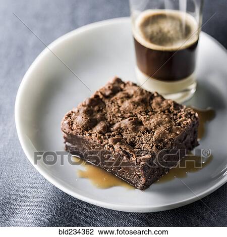 Brownie on plate with espresso View Large Photo Image Stock Image - Brownie on plate with espresso. Fotosearch