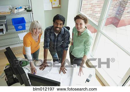 Business people working together in office View Large Photo Image Stock Photo - Business people working together in office. Fotosearch