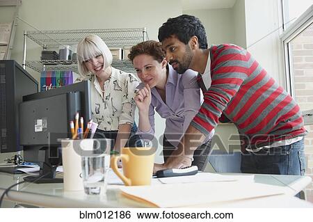 Business people working together in office View Large Photo Image Stock Photograph - Business people working together in office. Fotosearch