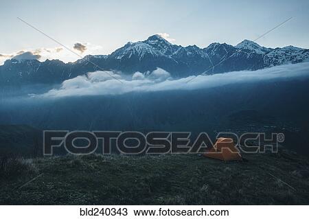 Stock Image - Camping tent in mountain landscape. Fotosearch