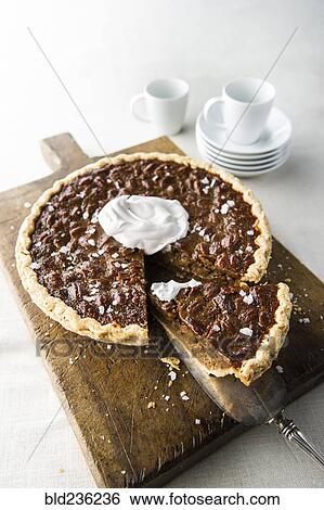 Caramel pecan pie on cutting board View Large Photo Image Stock Photograph - Caramel pecan pie on cutting board. Fotosearch