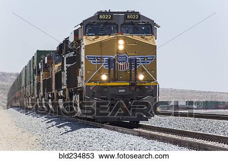 Cargo train on railroad track View Large Photo Image Stock Image - Cargo train on railroad track. Fotosearch