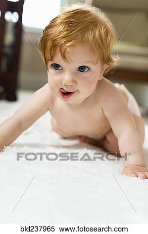 Caucasian baby boy crawling on carpet View Large Photo Image Stock Photography - Caucasian baby boy crawling on carpet. Fotosearch