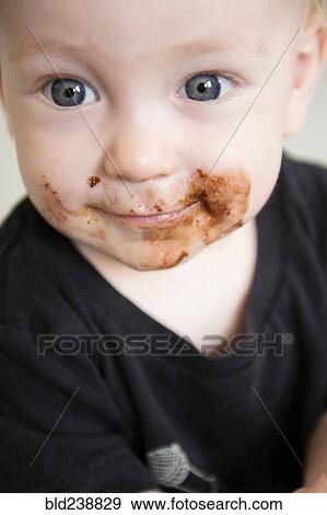 Stock Photo - Caucasian baby boy with messy face. Fotosearch