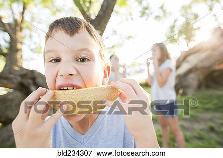 Caucasian boy eating cantaloupe View Large Photo Image Stock Photo - Caucasian boy eating cantaloupe. Fotosearch