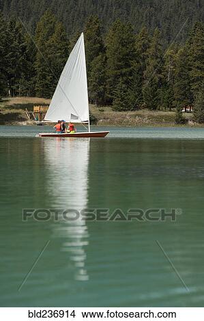 Caucasian boys and girl sailing on lake View Large Photo Image Picture - Caucasian boys and girl sailing on lake. Fotosearch