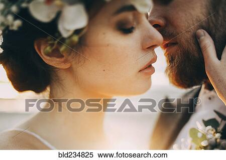 Caucasian bride and groom kissing View Large Photo Image Stock Photography - Caucasian bride and groom kissing. Fotosearch