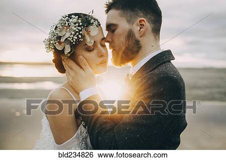Caucasian bride and groom on sunny beach View Large Photo Image Stock Photograph - Caucasian bride and groom on sunny beach. Fotosearch