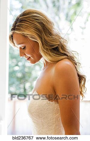 Caucasian bride looking down View Large Photo Image Stock Photo - Caucasian bride looking down. Fotosearch