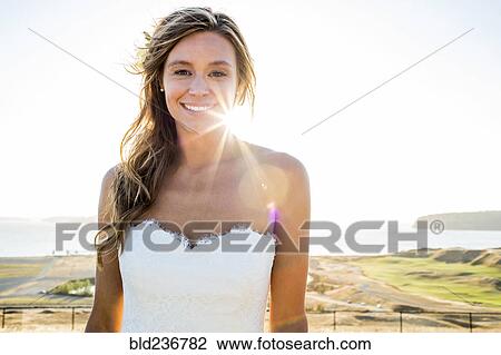 Caucasian bride smiling on sunny day View Large Photo Image Stock Image - Caucasian bride smiling on sunny day. Fotosearch