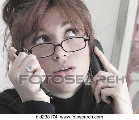 Picture - Caucasian businesswoman talking on telephone. Fotosearch